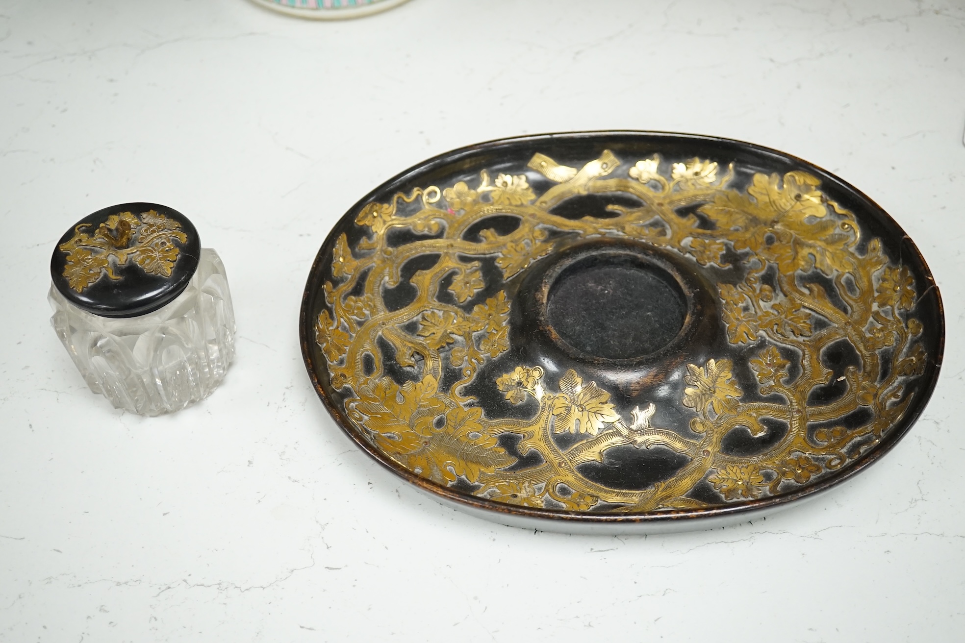 A Victorian ebonised and brass overlaid inkstand with cut glass ink well, 27cm wide. Condition - poor